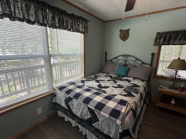 5127 Crestwood Rd, Lewiston, MI 49756 - bedroom with wood finished floors, lofted ceiling, and crown molding
