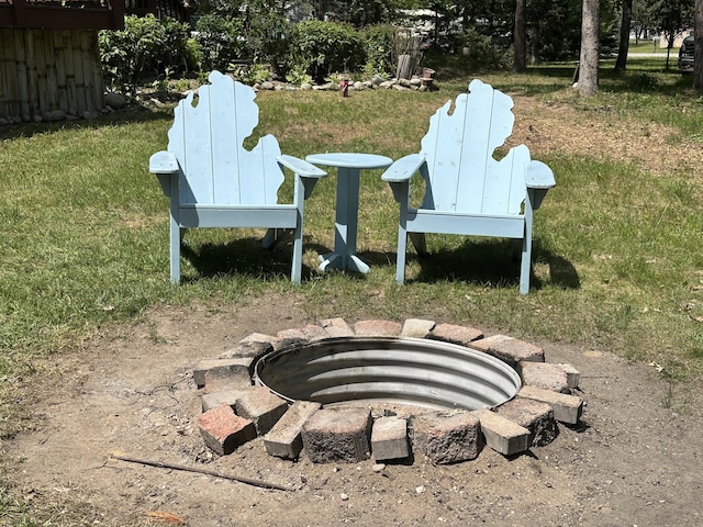 5127 Crestwood Rd, Lewiston, MI 49756 - view of yard featuring an outdoor fire pit