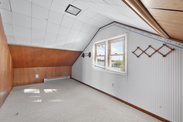 12328 W Shore Dr, Houghton Lake, MI 48629 - bonus room featuring a baseboard heating unit, lofted ceiling, carpet flooring, and wood walls