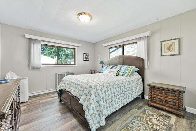 12328 W Shore Dr, Houghton Lake, MI 48629 - bedroom with wood finished floors and baseboards