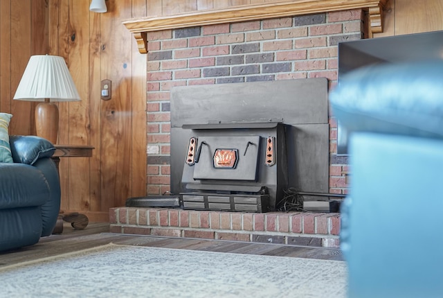 12328 W Shore Dr, Houghton Lake, MI 48629 - detailed view of wood finished floors, a wood stove, and wooden walls