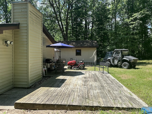 379 E Clarence Rd, Harrison, MI 48625 - wooden deck featuring a yard