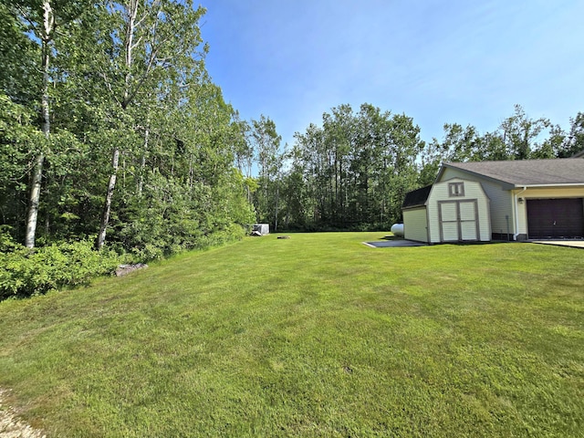 N705 Woods Rd, Saint Ignace, MI 49781 - view of green lawn with an outdoor structure