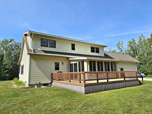 N705 Woods Rd, Saint Ignace, MI 49781 - rear view of property featuring a wooden deck, a lawn, roof with shingles, and a sunroom