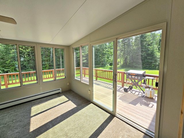 N705 Woods Rd, Saint Ignace, MI 49781 - unfurnished sunroom with lofted ceiling, carpet flooring, healthy amount of natural light, a wooden deck, and a baseboard heating unit
