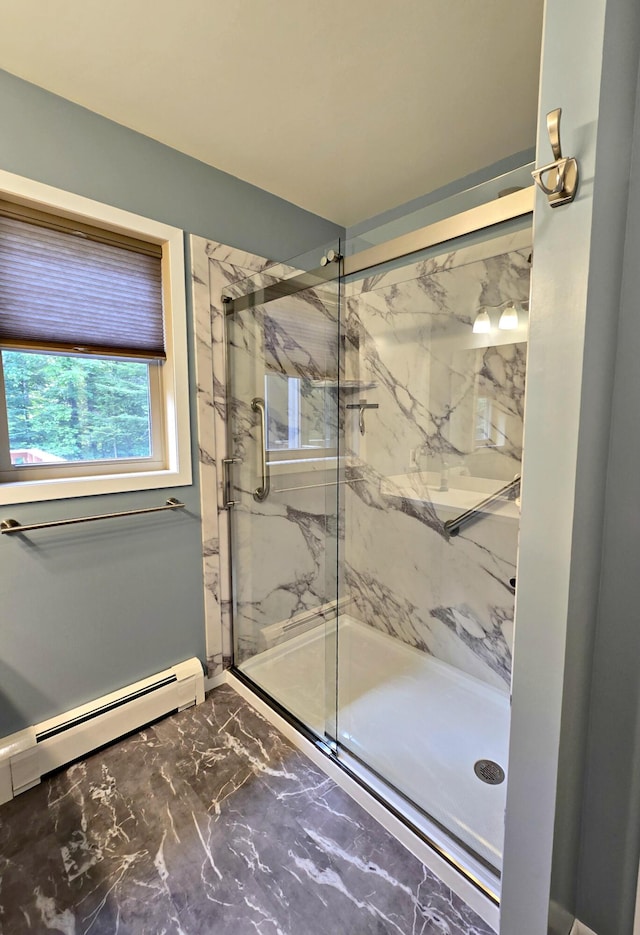 N705 Woods Rd, Saint Ignace, MI 49781 - bathroom with marble finish flooring, a marble finish shower, and a baseboard heating unit
