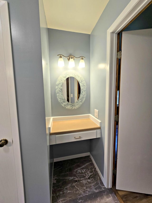 N705 Woods Rd, Saint Ignace, MI 49781 - bathroom featuring baseboards and marble look tiles