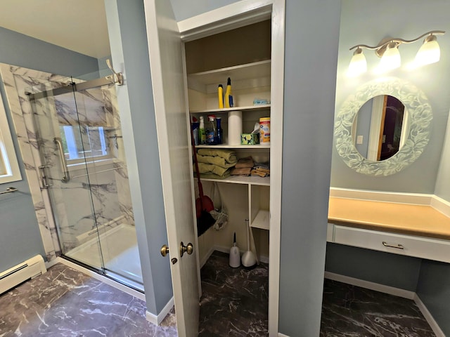 N705 Woods Rd, Saint Ignace, MI 49781 - full bath featuring marble look tiles, a marble finish shower, and a baseboard radiator