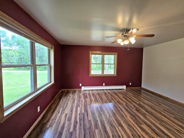 N705 Woods Rd, Saint Ignace, MI 49781 - unfurnished room with baseboard heating, wood finished floors, and ceiling fan