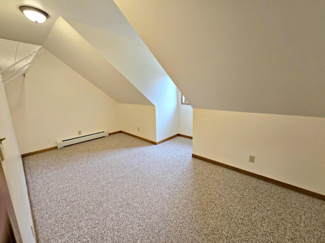 N705 Woods Rd, Saint Ignace, MI 49781 - bonus room with a baseboard heating unit, vaulted ceiling, and carpet flooring