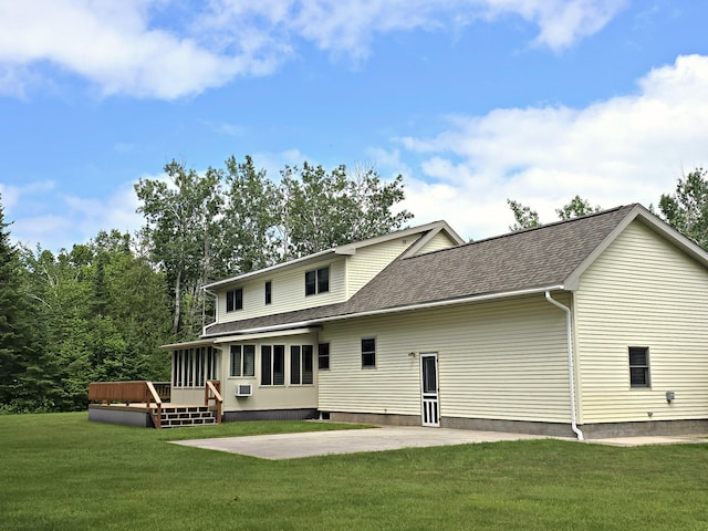 N705 Woods Rd, Saint Ignace, MI 49781 - rear view of property with a deck, a shingled roof, a yard, and a patio area