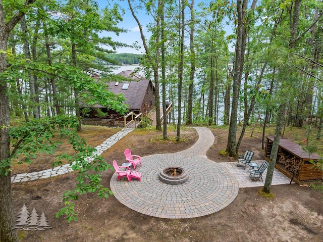 6609 Honey Ln, Johannesburg, MI 49751 - view of yard with a fire pit and a patio area