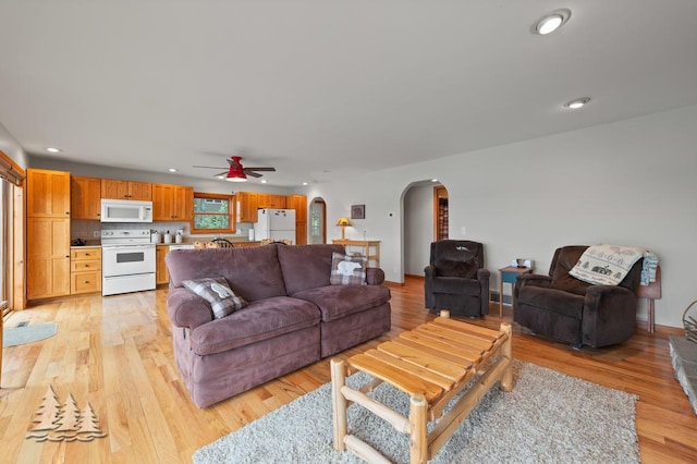 6609 Honey Ln, Johannesburg, MI 49751 - living area with arched walkways, a ceiling fan, recessed lighting, and light wood finished floors