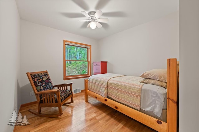 6609 Honey Ln, Johannesburg, MI 49751 - bedroom featuring light wood finished floors and ceiling fan