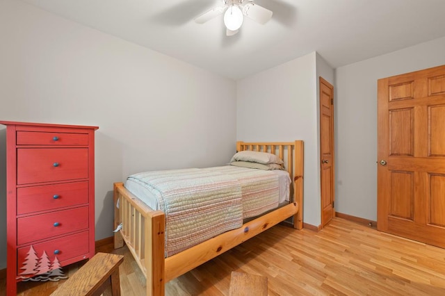 6609 Honey Ln, Johannesburg, MI 49751 - bedroom with light wood-type flooring and ceiling fan