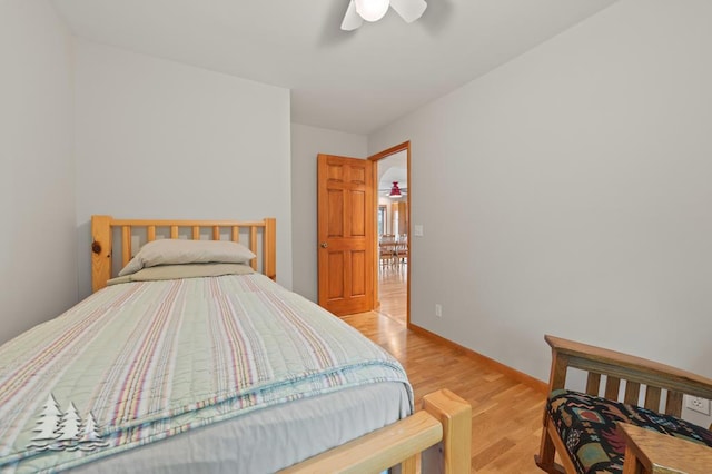 6609 Honey Ln, Johannesburg, MI 49751 - bedroom with light wood-style flooring and a ceiling fan