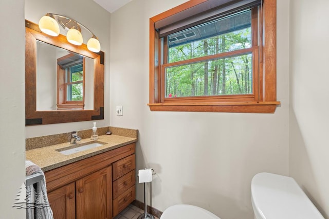 6609 Honey Ln, Johannesburg, MI 49751 - bathroom featuring toilet and vanity