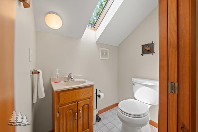 6609 Honey Ln, Johannesburg, MI 49751 - bathroom with a skylight, vanity, and lofted ceiling