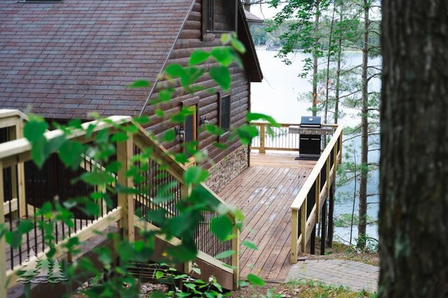 6609 Honey Ln, Johannesburg, MI 49751 - wooden terrace featuring area for grilling and a water view