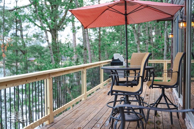 6609 Honey Ln, Johannesburg, MI 49751 - wooden terrace with view of wooded area