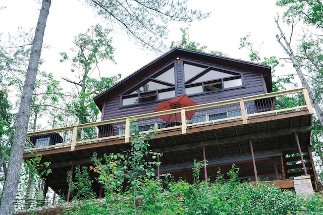 6609 Honey Ln, Johannesburg, MI 49751 - back of property with a wooden deck and faux log siding