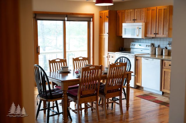 6609 Honey Ln, Johannesburg, MI 49751 - dining room featuring healthy amount of natural light and light wood-style floors