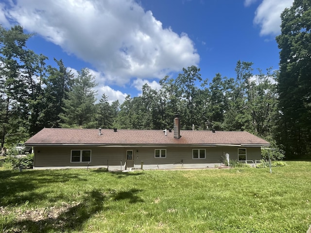 2359 Watson Hills Trl, Vanderbilt, MI 49795 - rear view of property featuring a yard