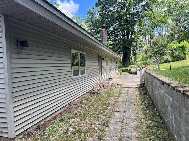 2359 Watson Hills Trl, Vanderbilt, MI 49795 - view of side of home with a chimney