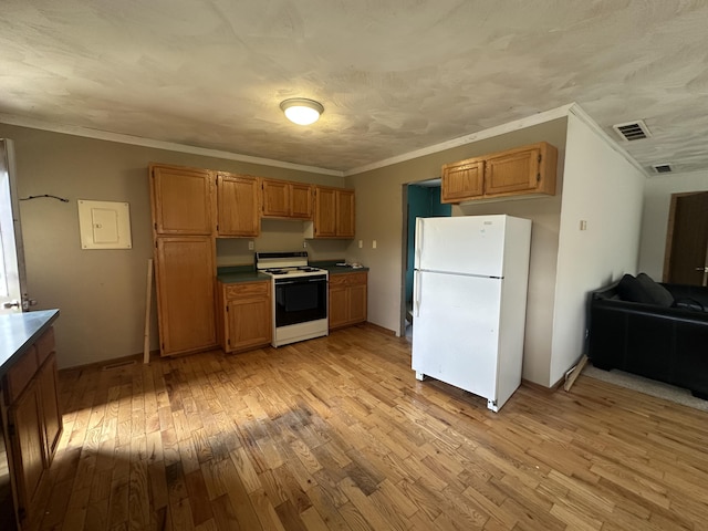 4974 Meridian Line Rd, Johannesburg, MI 49751 - kitchen featuring white appliances, light wood-style floors, crown molding, and brown cabinets