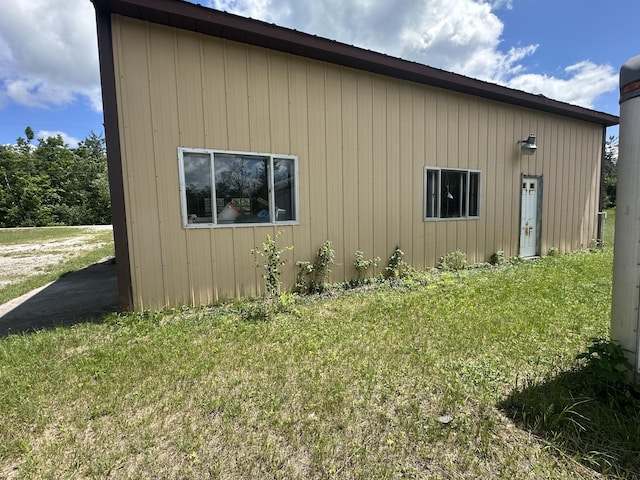 4974 Meridian Line Rd, Johannesburg, MI 49751 - view of side of home with a yard