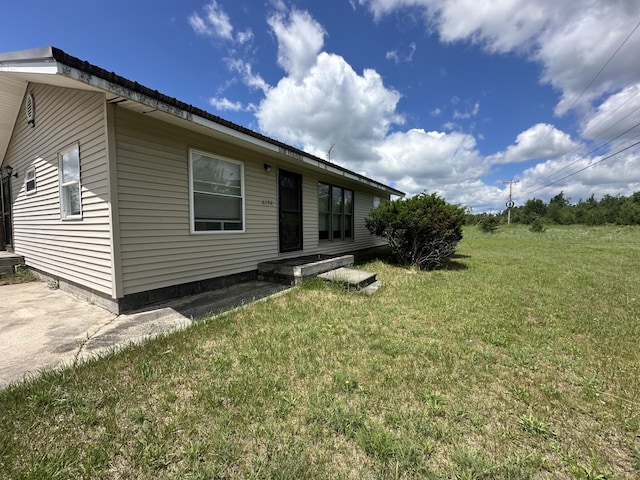 4974 Meridian Line Rd, Johannesburg, MI 49751 - back of house with a lawn