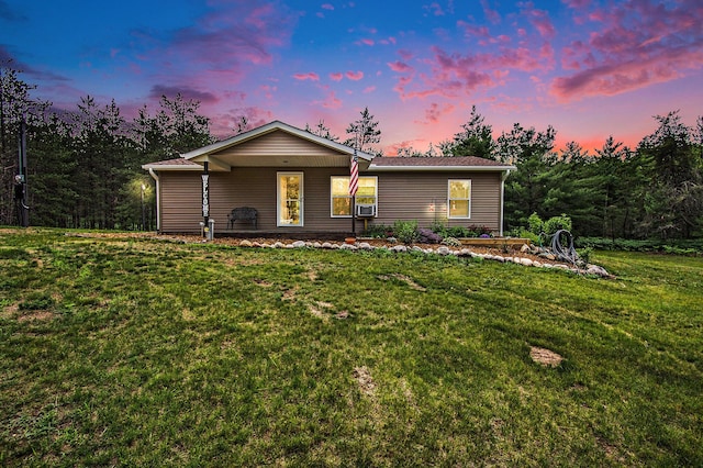 6691 Boone Ln, Vanderbilt, MI 49795 - ranch-style house featuring a yard and cooling unit