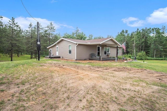6691 Boone Ln, Vanderbilt, MI 49795 - view of side of home with a lawn