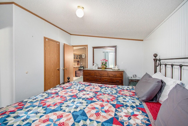 6691 Boone Ln, Vanderbilt, MI 49795 - bedroom with ornamental molding, lofted ceiling, and a textured ceiling
