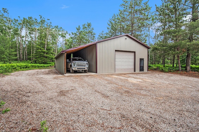6691 Boone Ln, Vanderbilt, MI 49795 - garage with a detached garage and dirt driveway