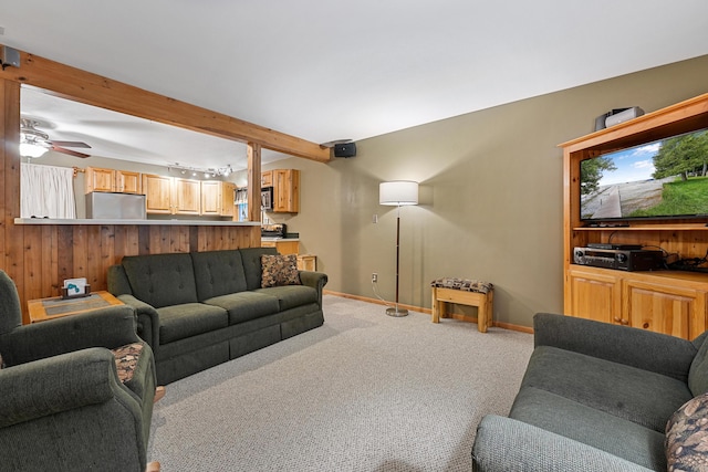 120 Clyde St, Roscommon, MI 48653 - carpeted living area with a ceiling fan and beam ceiling