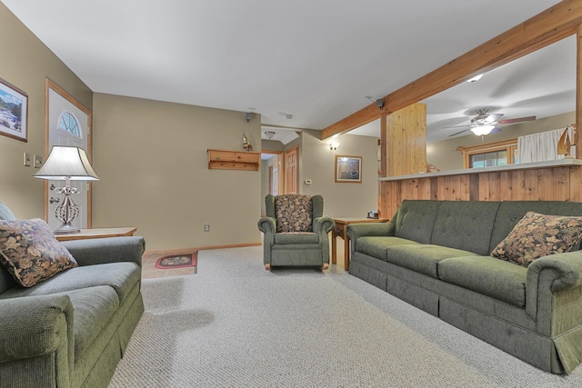 120 Clyde St, Roscommon, MI 48653 - carpeted living room with beamed ceiling, plenty of natural light, and a ceiling fan