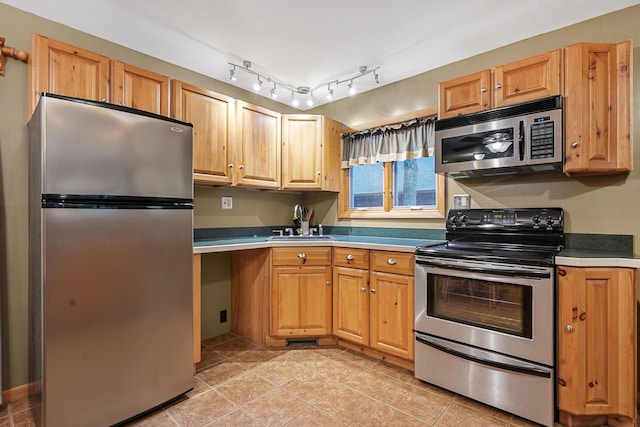 120 Clyde St, Roscommon, MI 48653 - kitchen with appliances with stainless steel finishes and light tile patterned floors