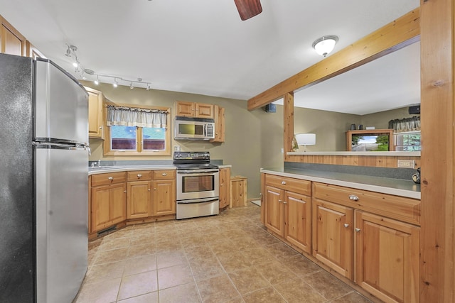 120 Clyde St, Roscommon, MI 48653 - kitchen with appliances with stainless steel finishes, beamed ceiling, healthy amount of natural light, and light countertops