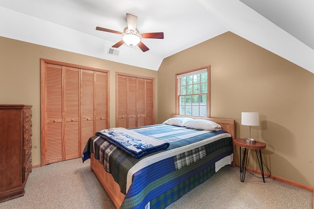 120 Clyde St, Roscommon, MI 48653 - bedroom featuring multiple closets, light colored carpet, vaulted ceiling, and a ceiling fan