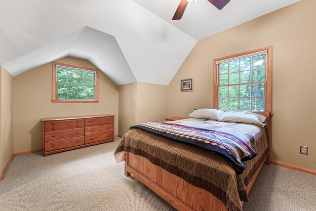 120 Clyde St, Roscommon, MI 48653 - carpeted bedroom featuring vaulted ceiling and a ceiling fan