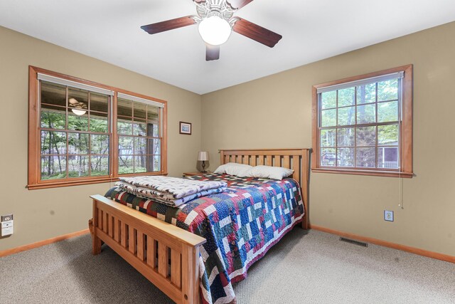 120 Clyde St, Roscommon, MI 48653 - carpeted bedroom featuring baseboards and a ceiling fan