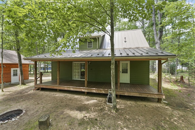 120 Clyde St, Roscommon, MI 48653 - back of house with a metal roof