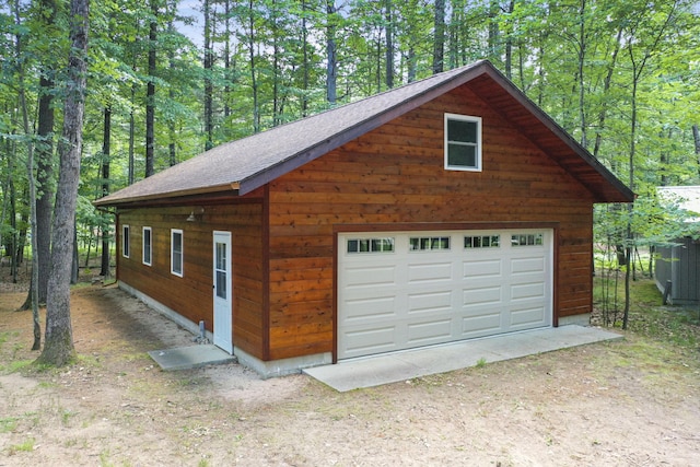 120 Clyde St, Roscommon, MI 48653 - detached garage with a wooded view