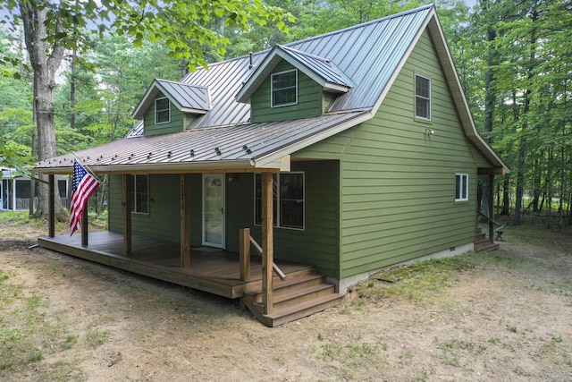 120 Clyde St, Roscommon, MI 48653 - view of front facade featuring a standing seam roof and a metal roof