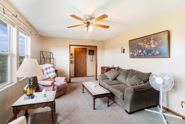 1680 W Huffman Lake Rd, Vanderbilt, MI 49795 - carpeted living area featuring a ceiling fan and baseboards