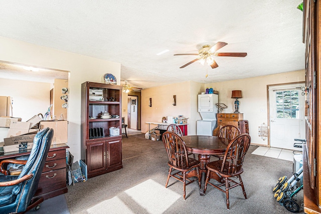 1680 W Huffman Lake Rd, Vanderbilt, MI 49795 - carpeted dining area featuring ceiling fan, stacked washer and clothes dryer, and a textured ceiling