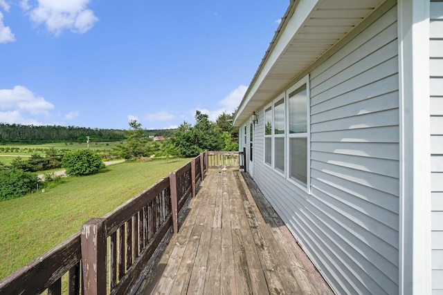 1680 W Huffman Lake Rd, Vanderbilt, MI 49795 - deck featuring a lawn