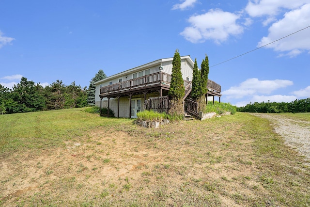 1680 W Huffman Lake Rd, Vanderbilt, MI 49795 - back of property featuring a deck and a yard