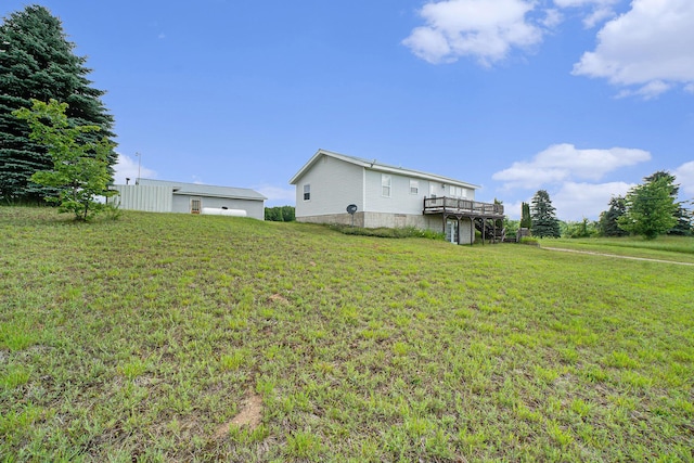 1680 W Huffman Lake Rd, Vanderbilt, MI 49795 - view of green lawn with a deck